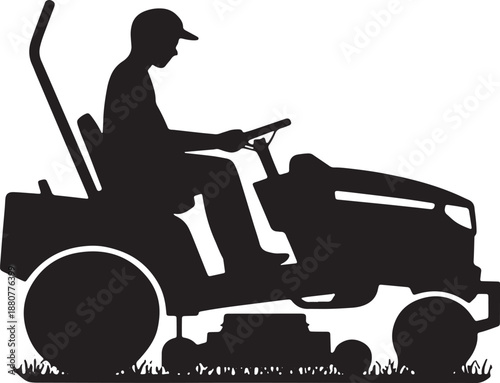 Silhouette of a person wearing a cap driving a riding lawn mower over grass