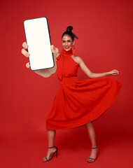Asian woman holding smartphone with blank screen for Chinese New Year 2026 promotion female model presenting mobile app digital marketing festive online shopping technology lifestyle holiday sales.