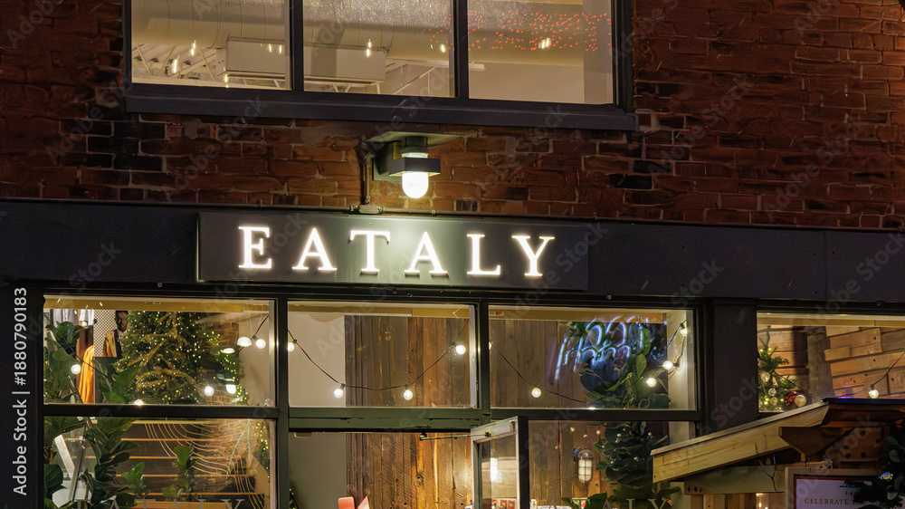 Fototapeta premium Illuminated entrance sign for Eataly, a business in the Distillery District, Toronto, Canada