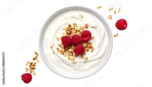 Overhead shot of a white bowl filled with yogurt, granola, and fresh raspberries