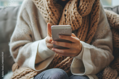 Hands holding smartphone with blank screen, clean modern lifestyle mockup