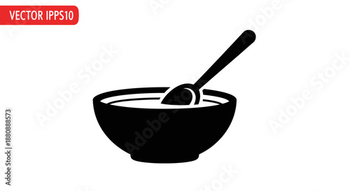 Black bowl with spoon inside.