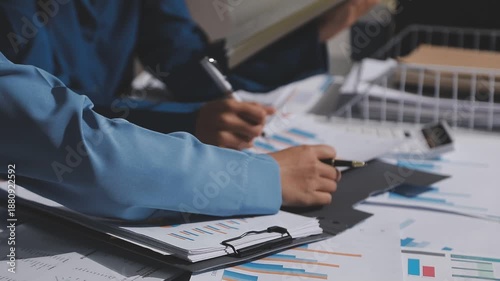 Asian male financial officer or accountant checking investment results Financial budget analysis Planning to summarize results and report to the meeting Audit concept and investment results.