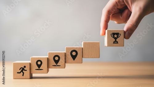 Achieving success: building steps towards a goal with a trophy icon
