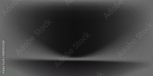 Empty dimly lit studio or stage featuring a black leather texture on floor. Single spotlight from above illuminates the ground creating  subtle gradient effect against the otherwise dark background