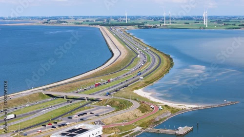 cluster dark modern visitor buildings integrated into landscape historic grassy bunkers winding footpaths sit major highway afsluitdijk netherlands near architecture 
