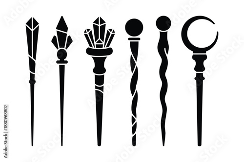Set of mystical magic wands and crystal staff silhouettes