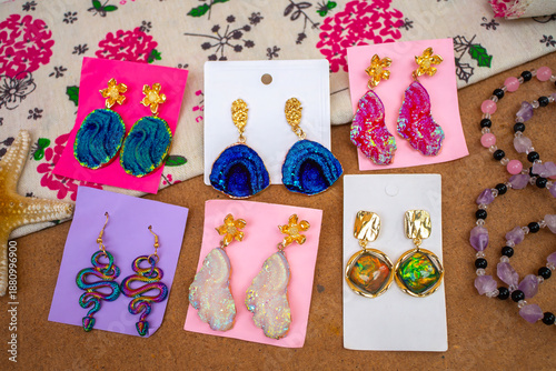 a collection of festive earrings on a table