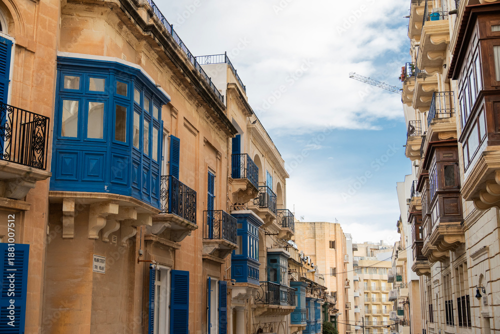 Fototapeta premium Building facades on historic streets in Malta Sliema with balconies