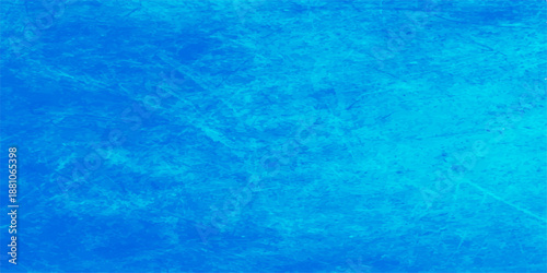 An abstract blue grunge background features a cool turquoise water surface pattern with clear ripples and light reflections on a wet liquid ocean texture