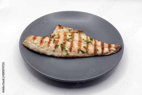 grilled sea bream fish with herbs food dish on white background