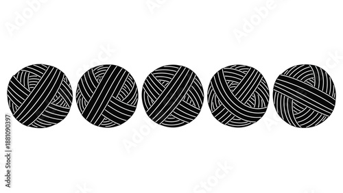 five black and white yarn balls in a row on a plain background