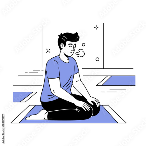 Young male practicing yoga meditation indoors with calm focus