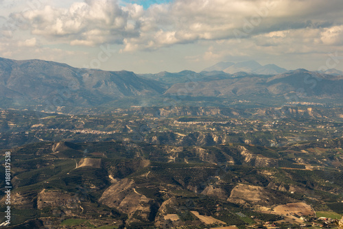 View from above - the beautifull countryside of Crete. Rural landscape, olive groves and country dirt-roads.