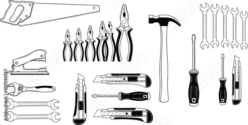 Collection of assorted hand tools including saw, pliers, hammer, wrenches, screwdrivers, knives, and stapler arranged neatly for construction and DIY concepts