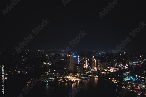 Wallpaper Mural Cairo Skyline at Night with Vibrant City Lights Reflected on the Nile Torontodigital.ca