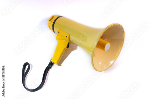 Yellow megaphone or bullhorn isolated on a white background. A portable loudspeaker with a black strap used for announcements, protests, and directing crowds