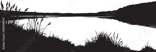 Serene landscape with silhouette of lake and grassy shore