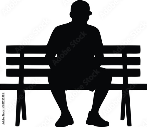 Silhouette of man sitting on park bench waiting alone in public space for outdoor relaxation