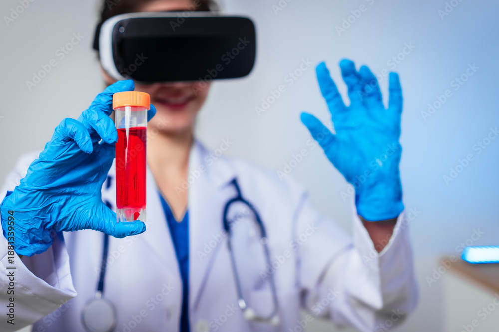 Fototapeta premium Female doctor wearing virtual reality headset examines blood sample during immersive medical simulation, combining digital healthcare technology,laboratory analysis,and innovative clinical training