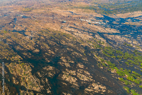 Cuadro en lienzo Aerial panorama of rugged stone channels and scattered greenery at Tat Somphamit Waterfalls, also known as Li Phi Falls, in Champasak Province, southern Laos