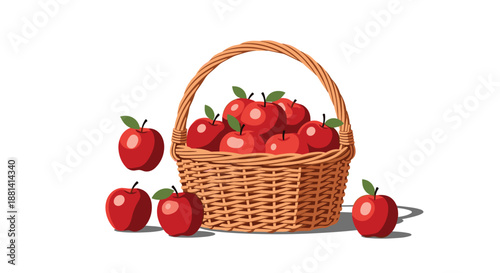 Wicker basket overflowing with ripe red apples with a few more apples resting on the ground next to it for harvest themes.