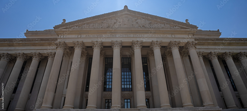 Fototapeta premium Archives of the United States of America. Archives of the USA building with monumental neoclassical columns. Archives historic building in America. Classical columned facade of the Archives of the