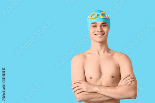 Young male swimmer on blue ...