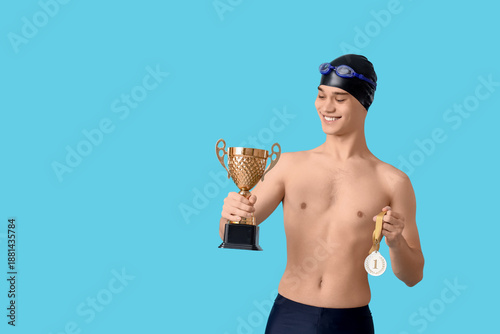 Young male swimmer with gol...