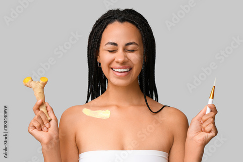 Smiling young woman applyin...