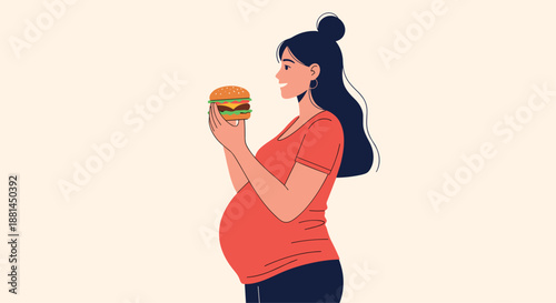 Happy pregnant woman satisfying her food cravings by holding a large delicious hamburger with a bright smile on a cream background.