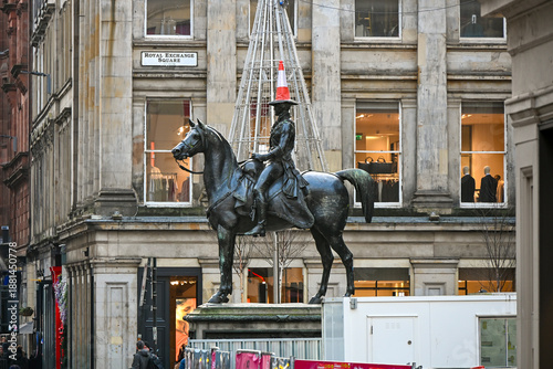 side view of  the Duke of Wellington Statue with a traffic cone in Glasgow, Scotland