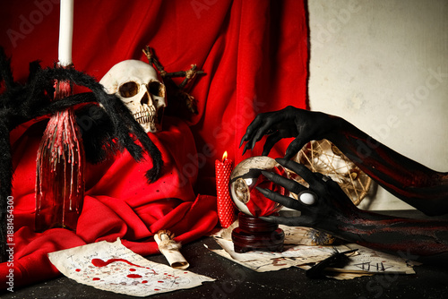Bloody witch hands with mag...