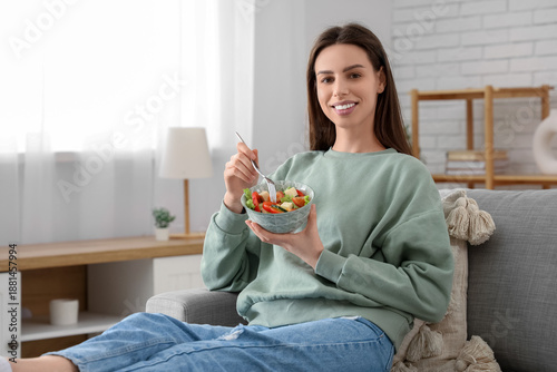 Young woman with bowl of ve...