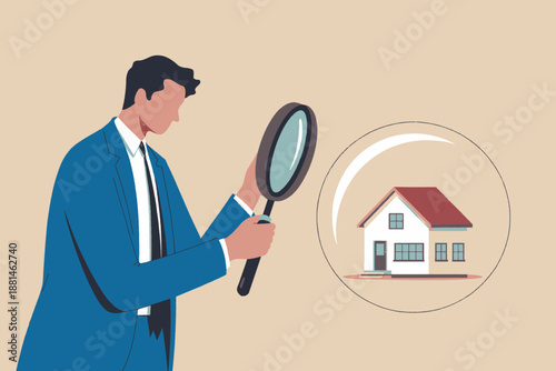Man in suit meticulously inspecting a small house with a magnifying glass for real estate analysis