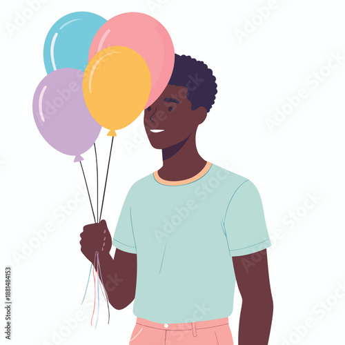 A young man holding colorful balloons in a joyful celebration scene