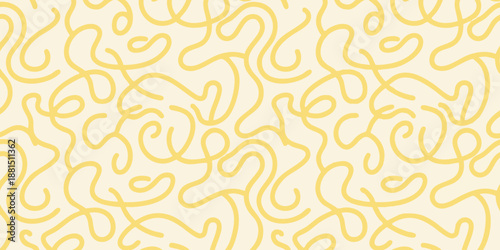 Intricate yellow lines forming a complex pattern on a neutral background viewed from directly above