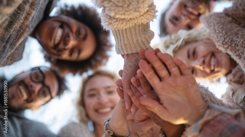 Joyful Group of Friends Together Piling Hands in a Circle Outdoors