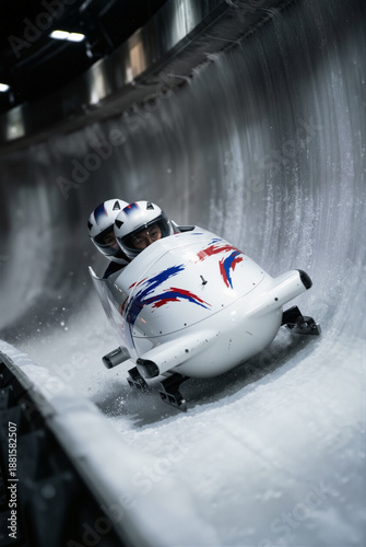 Bobsled team races down the icy track during a winter sports competition in a sliding center