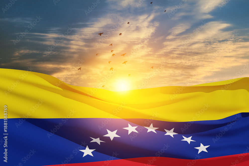Obraz premium Venezuela flag on background of sunset sky with flying birds. Patriotic concept. Banner with place for text.