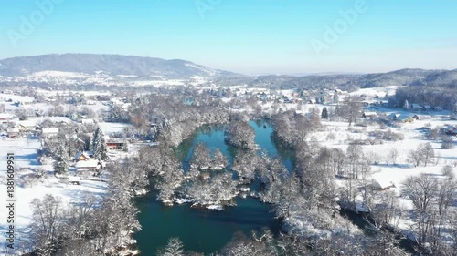 Winter in Croatia. Mreznica River in village of Belavici, waterfalls, idyllic rural winter landscape