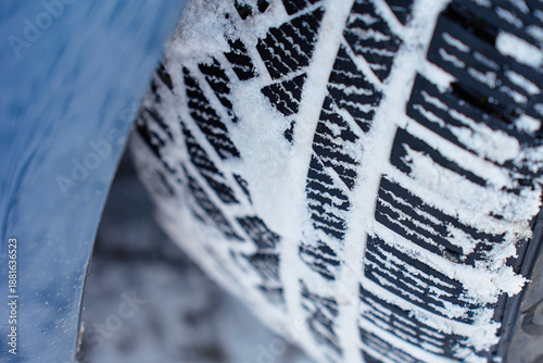 Wallpaper Mural Close up of winter car tire tread pattern covered with snow and ice. Concept of safety winter driving, vehicle traction, grip and cold weather road conditions Torontodigital.ca