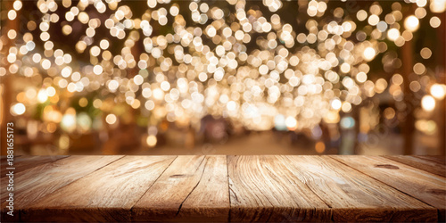 A rustic wooden table set against a beautiful bokeh lights background, perfect for product displays or festive scenes.