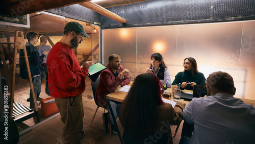 Canvas Print Diverse team discussing ideas during modern office meeting