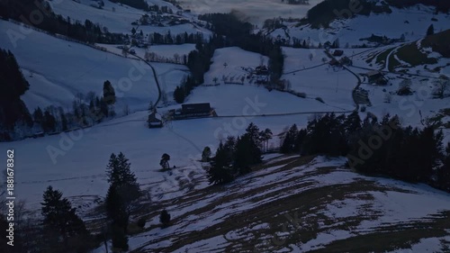 Aerial footage slowly shows the sunset over the mountains and the cloud sea in Switzerland