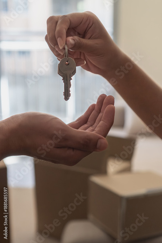 Quadro em tela Hands exchanging home keys representing new ownership moving