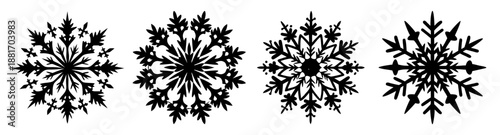 Collection of four unique snowflakes with intricate branching patterns