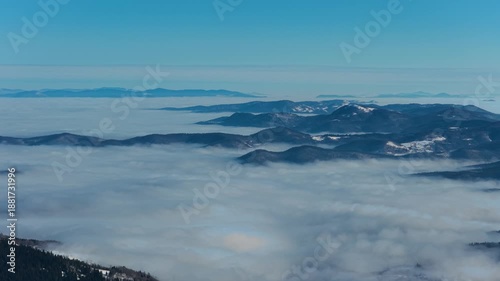 Wallpaper Mural Forward moving drone shot above sea of fog and mountain terrain, delivering immersive winter landscape and cinematic depth Torontodigital.ca