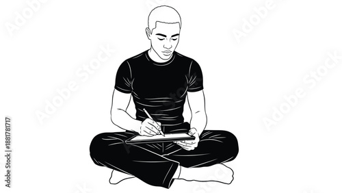 Young man in meditative pose drawing or writing in notebook with focused expression