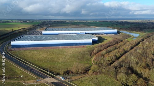 Cinematic Aerial View of Crick Logistics Hub in England, Major Industrial Transport Terminal with Massive Warehouses for UK Import and Export Trade